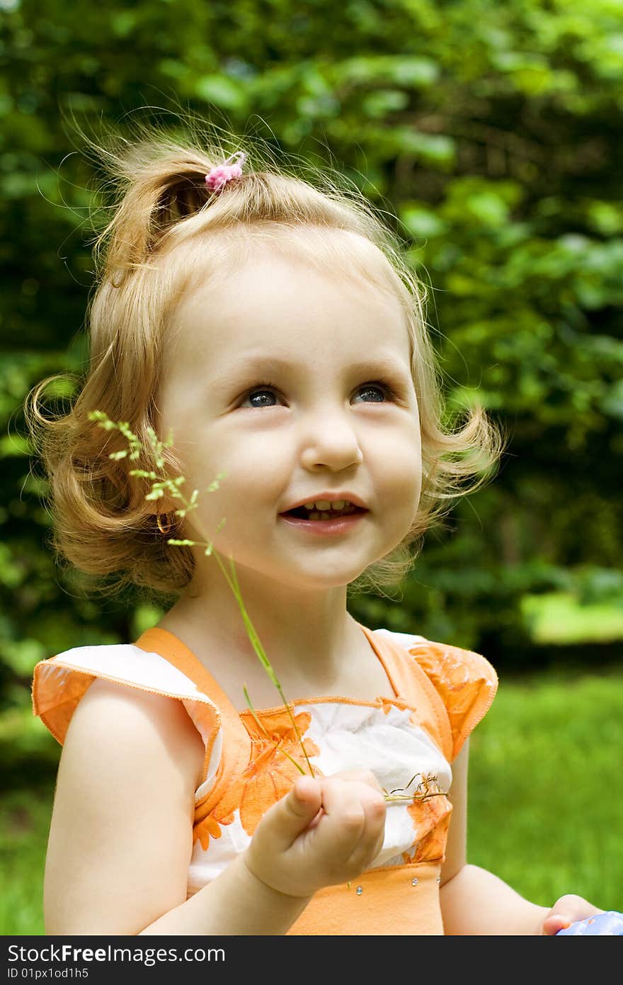 The portrait of the little girl looking up. The portrait of the little girl looking up