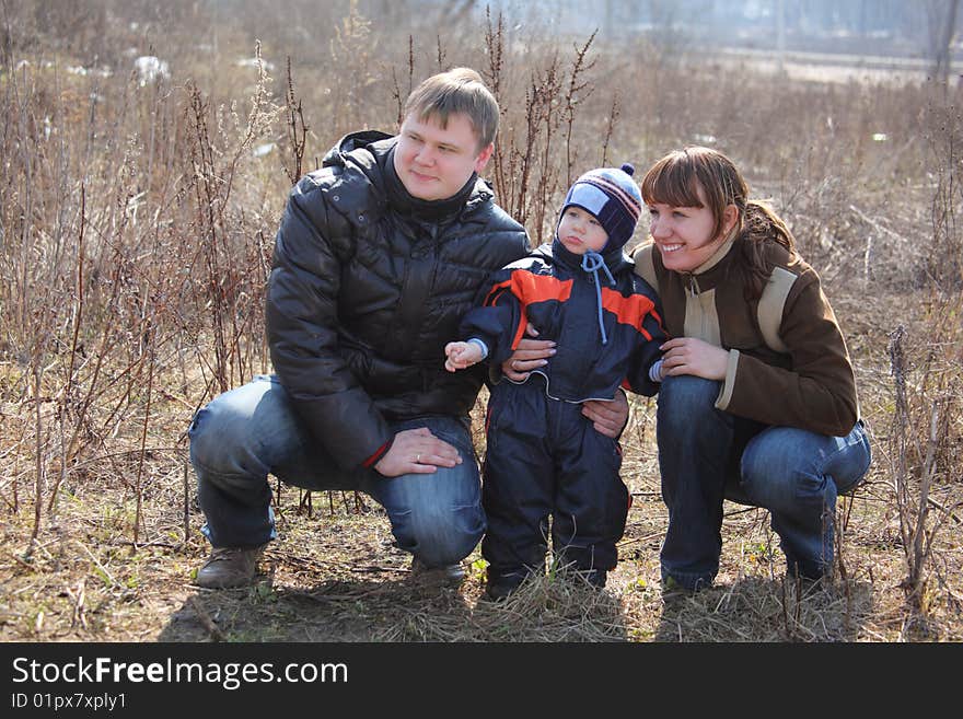 Parents with child outdoor in spring