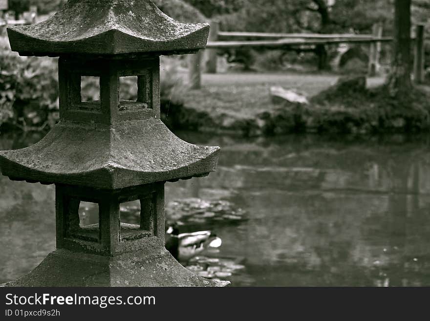 Vintage photo of stoned sculpture in a japanese garden