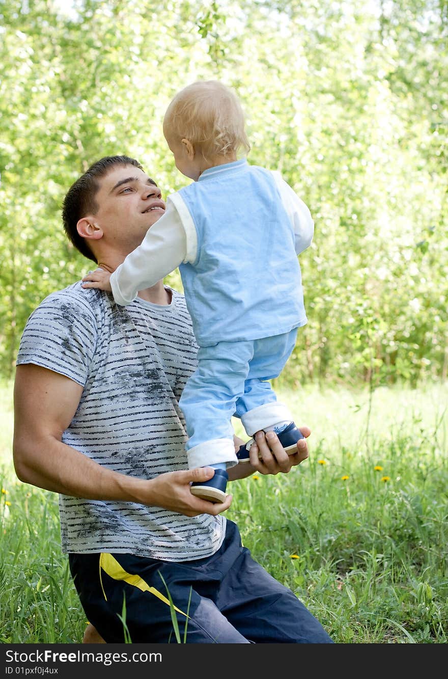 Father And Little Son Outdoor Fun In Summer