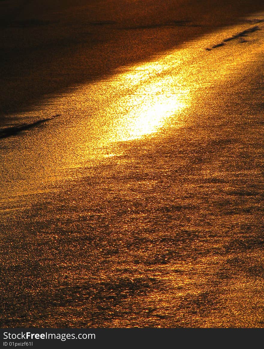 Wet road after sprinkling-machine with sun reflection. Wet road after sprinkling-machine with sun reflection