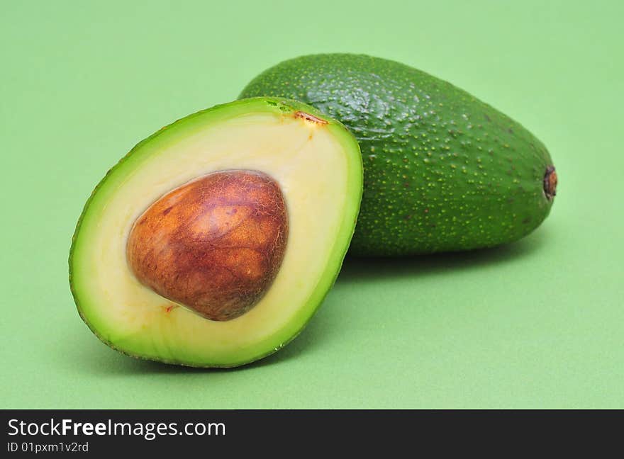 Avocado on green a background