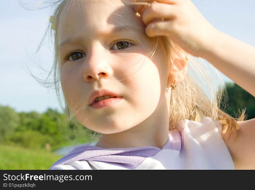 Portrait of the girl correcting hair. Portrait of the girl correcting hair.