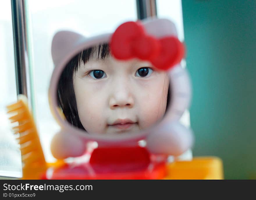 Bright picture of adorable chinese girl in the Mirror. Bright picture of adorable chinese girl in the Mirror