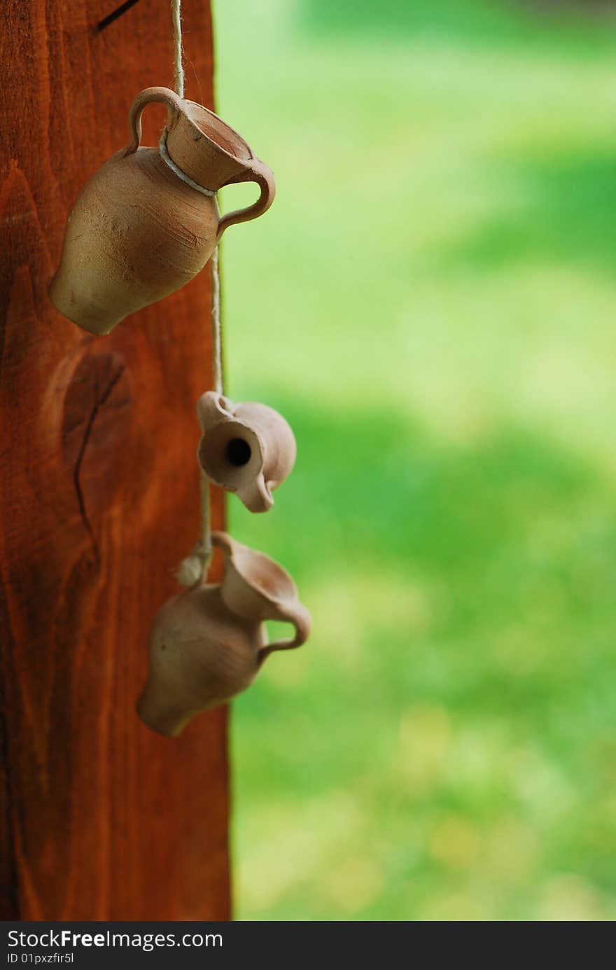 Small ceramic jars on a string. Small ceramic jars on a string