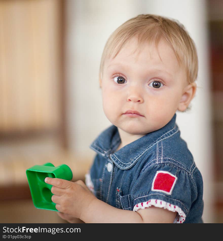 Portrait of a baby with a toy - shallow DOF