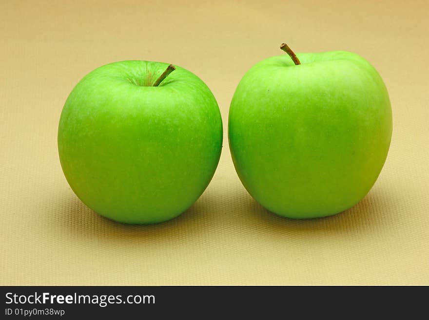 Two fresh green apples (background)