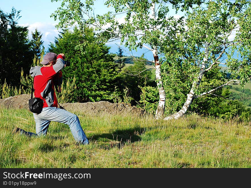 Photographer taking some images outdoors. Photographer taking some images outdoors