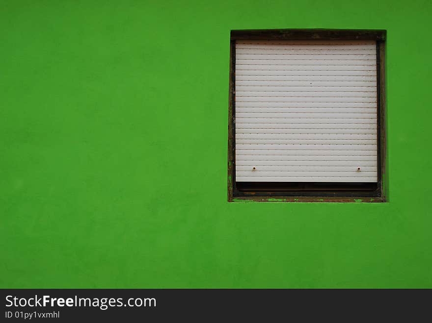 Window in a green wall. Window in a green wall