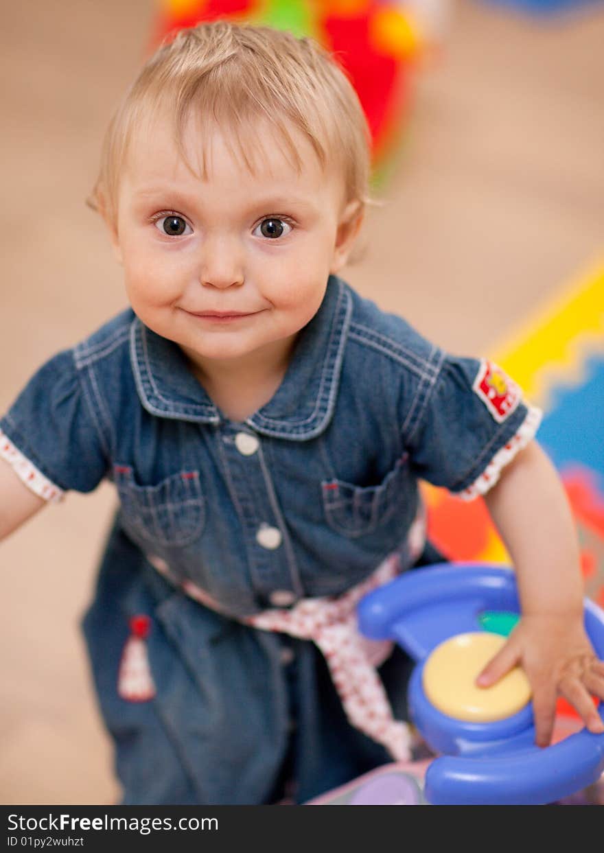 Portrait of a baby with a toy - shallow DOF