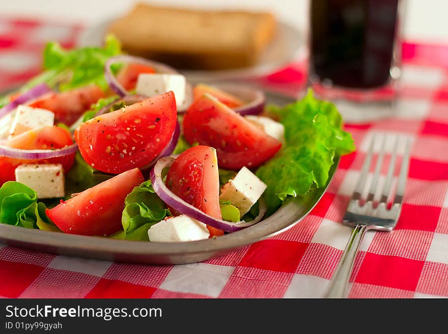 Greek salad with tomatoes cheese, herbs and onions