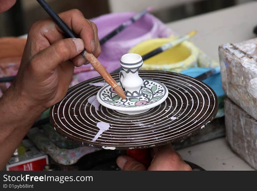 Arab Artisan Hand-Paints a Traditional Souvenir in Hebron. Arab Artisan Hand-Paints a Traditional Souvenir in Hebron