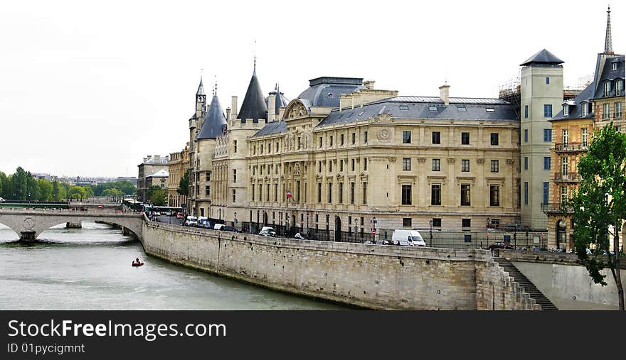 View of Palais de Justice and a bridge over the Seine river. Paris, France. View of Palais de Justice and a bridge over the Seine river. Paris, France.