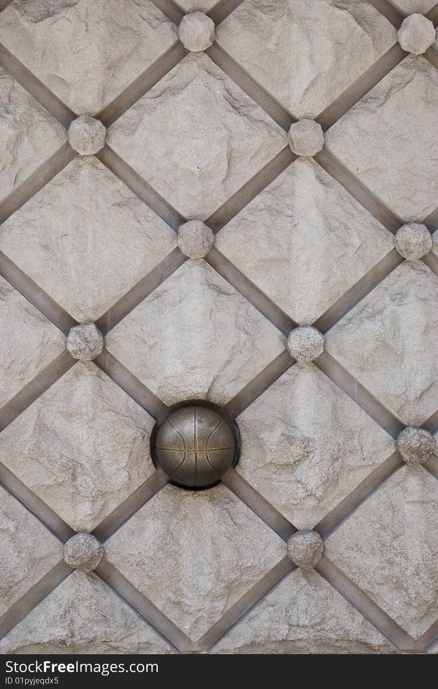 Details of stone wall decoration with bronze ball