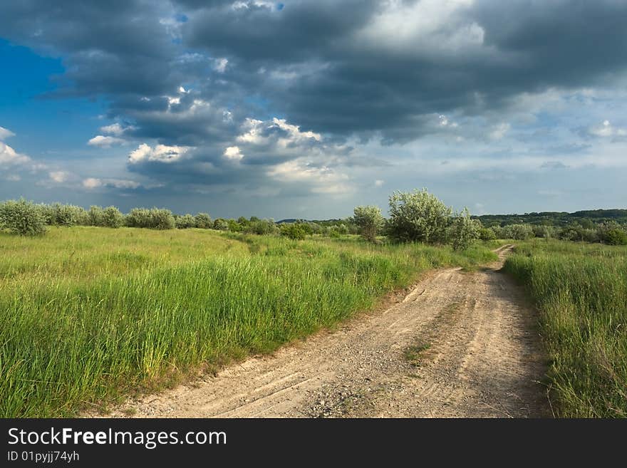 Road and sky with clouds