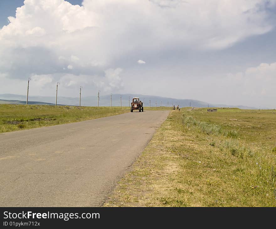 Old tractor on the rural route in Georgia, Caucasus. Old tractor on the rural route in Georgia, Caucasus