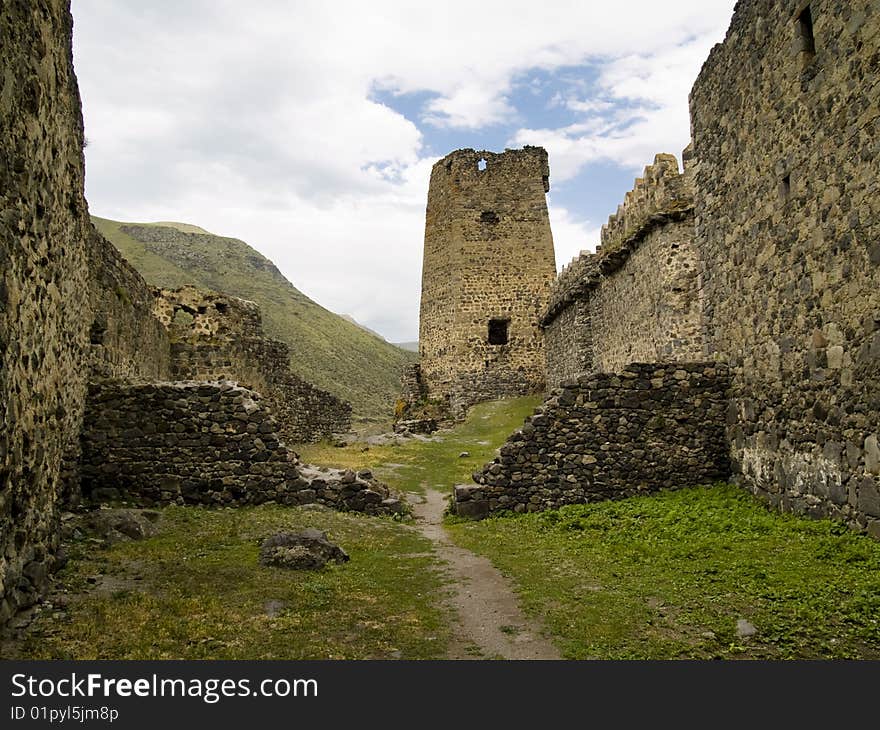 Old fortification in georgia, Caucasus. Old wall. Blue sky, summer day. Old fortification in georgia, Caucasus. Old wall. Blue sky, summer day