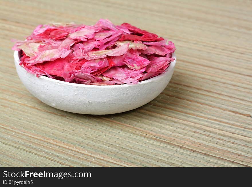 Paper bowl with dried petals. Paper bowl with dried petals