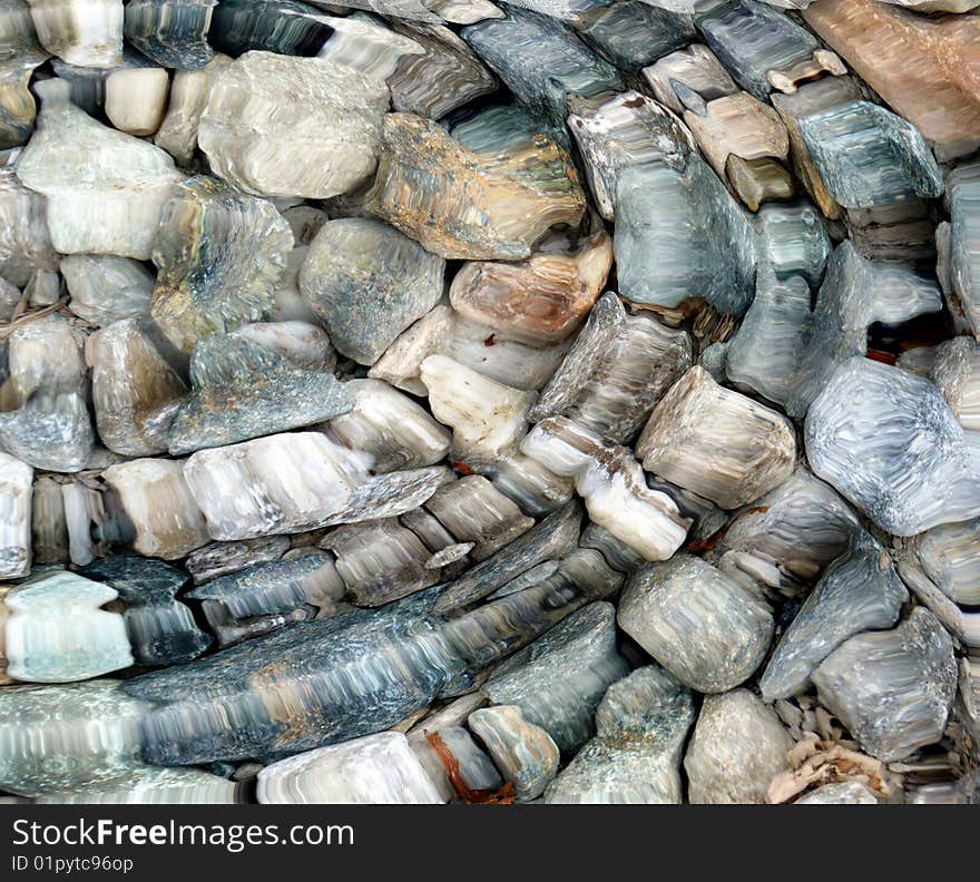 Colorful stones under water background