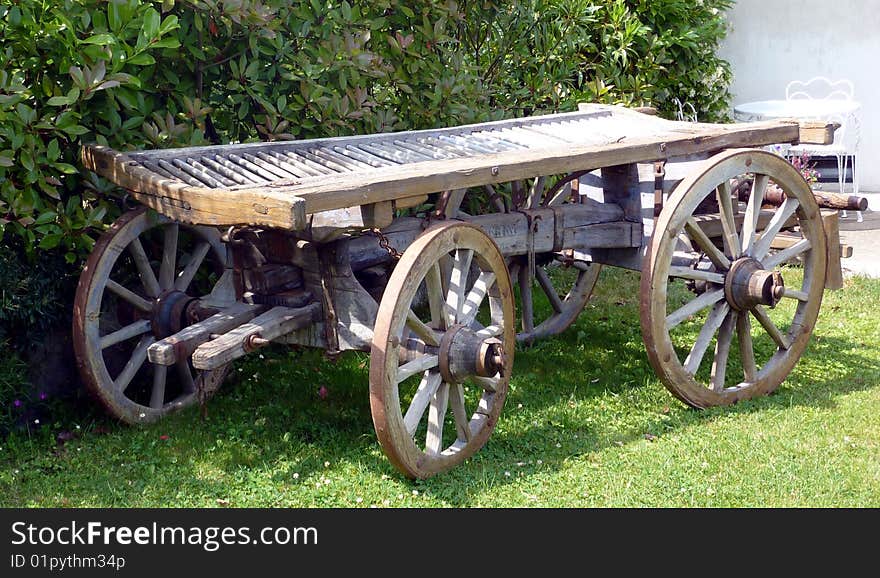 Old wooden wagon on the lawn