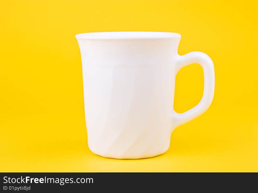 Your morning breakfast mug. Isolated on yellow