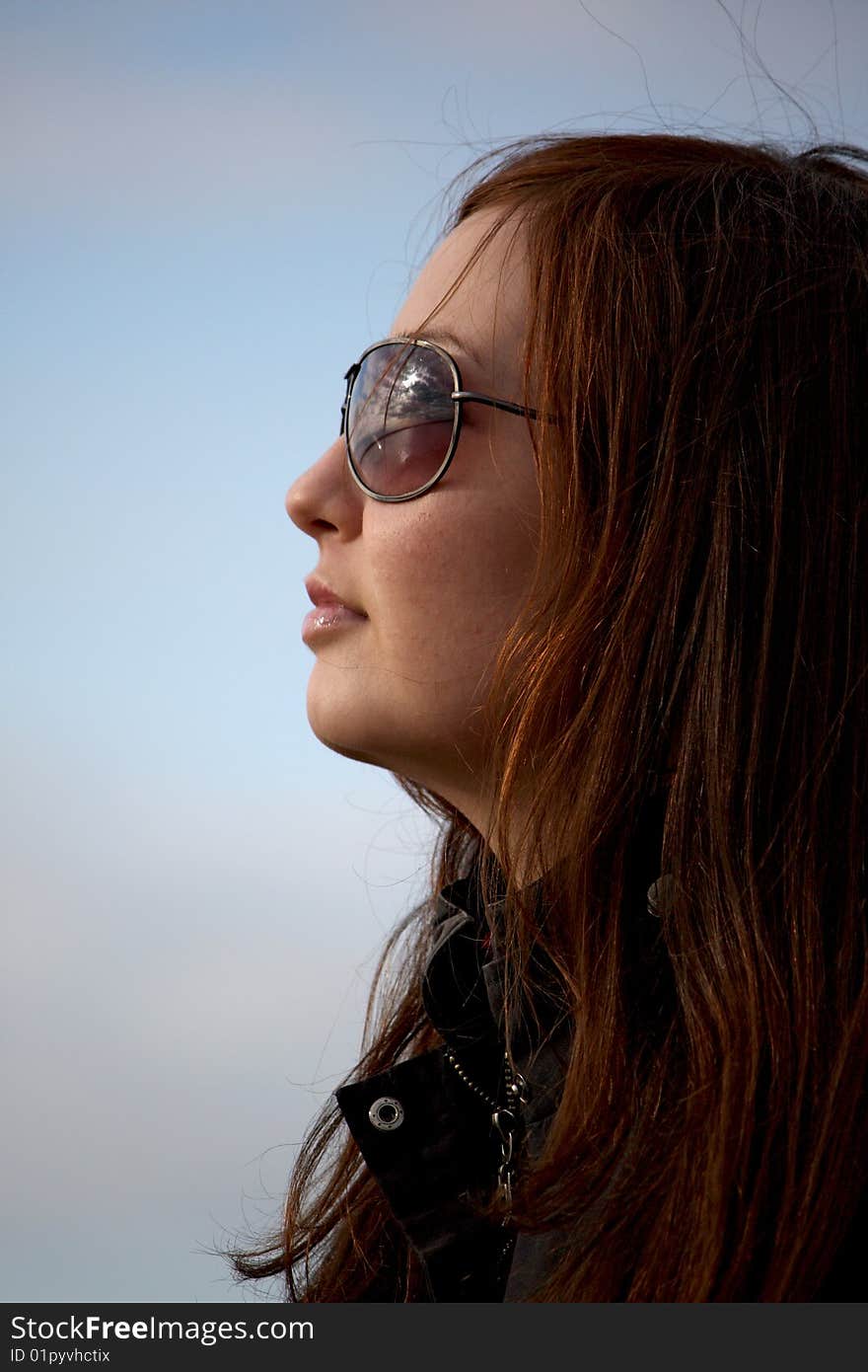 The young beautiful woman in glasses. The young beautiful woman in glasses