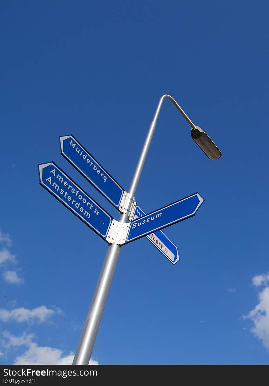 Road sign with directions to several cities in the Netherlands. Road sign with directions to several cities in the Netherlands.