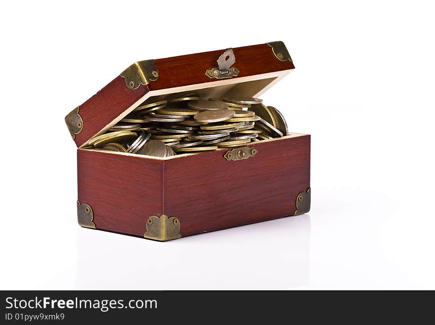 Wooden chest with coins inside isolated. Wooden chest with coins inside isolated