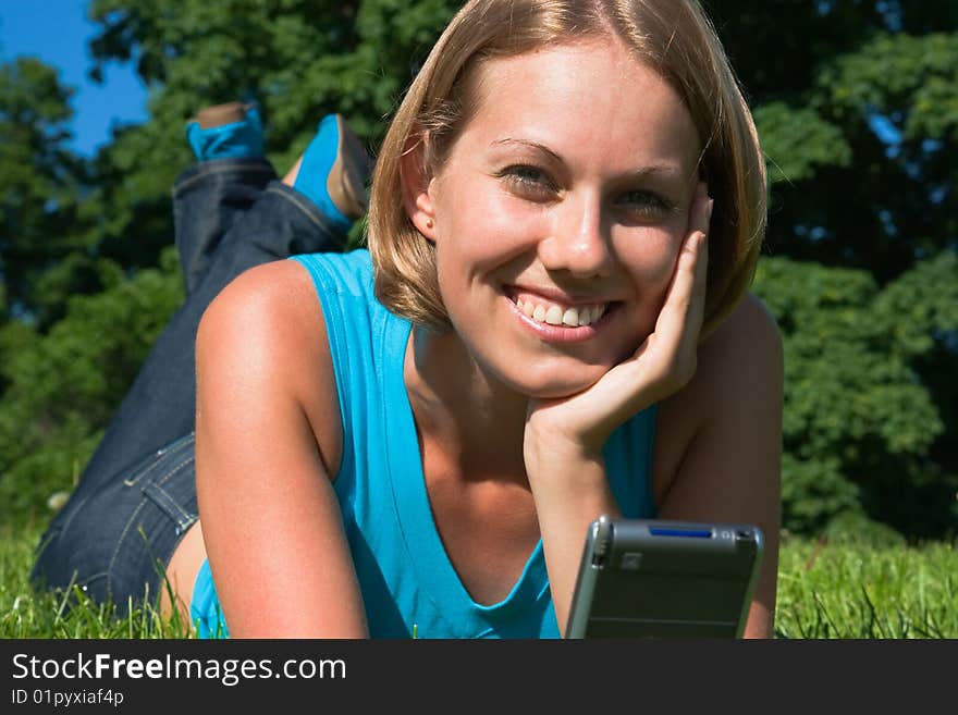 Young Woman Look In The Pocket Computer