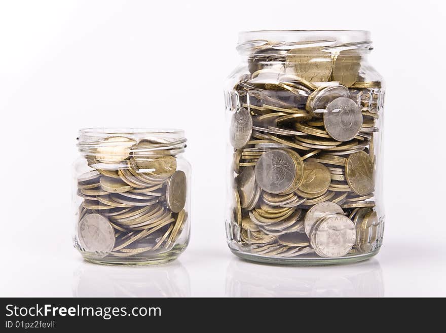 Jar money with coins inside isolated. Jar money with coins inside isolated