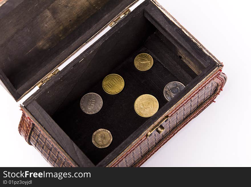 Wooden chest with coins inside isolated. Wooden chest with coins inside isolated