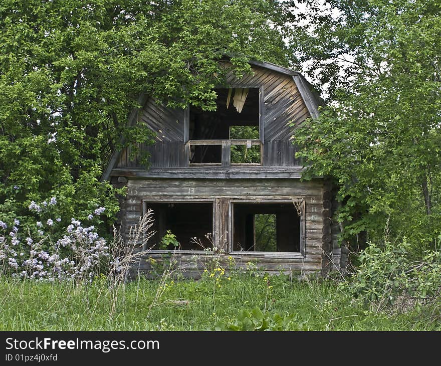 Abandoned house among trees in small russian village. Abandoned house among trees in small russian village