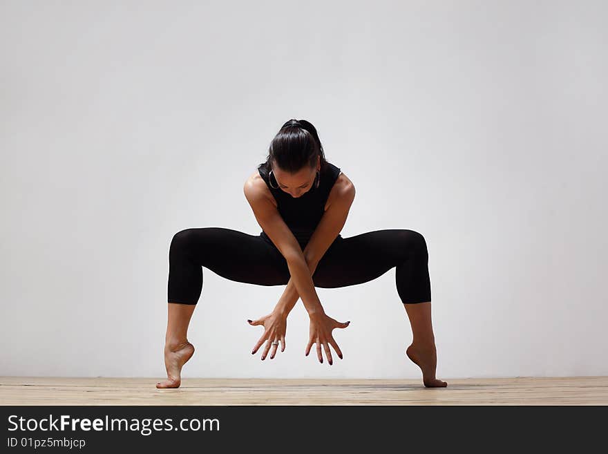 Modern style dancer posing on studio background. Modern style dancer posing on studio background