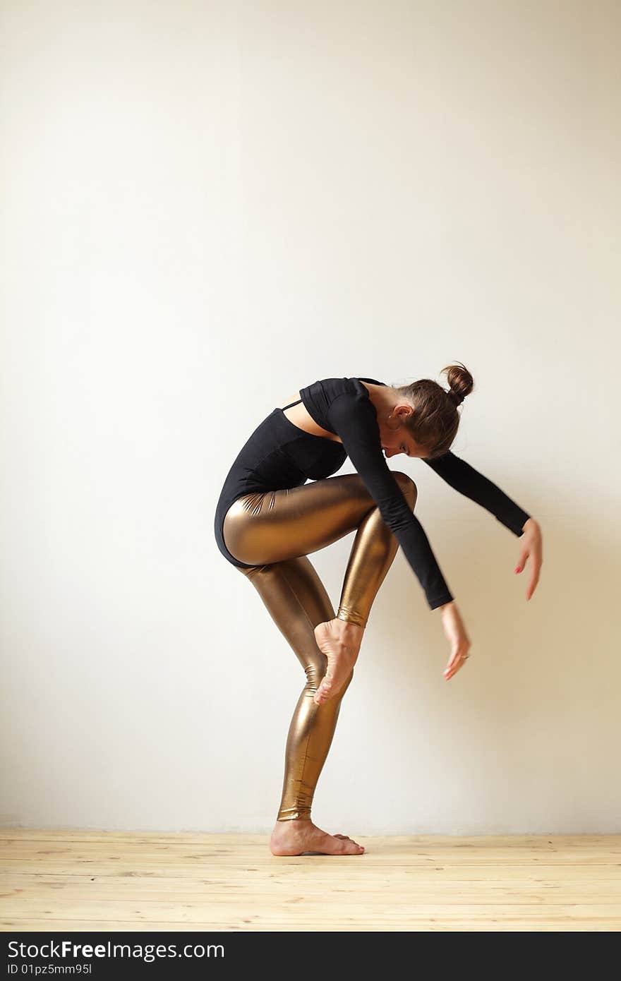 Modern style dancer posing on studio background. Modern style dancer posing on studio background