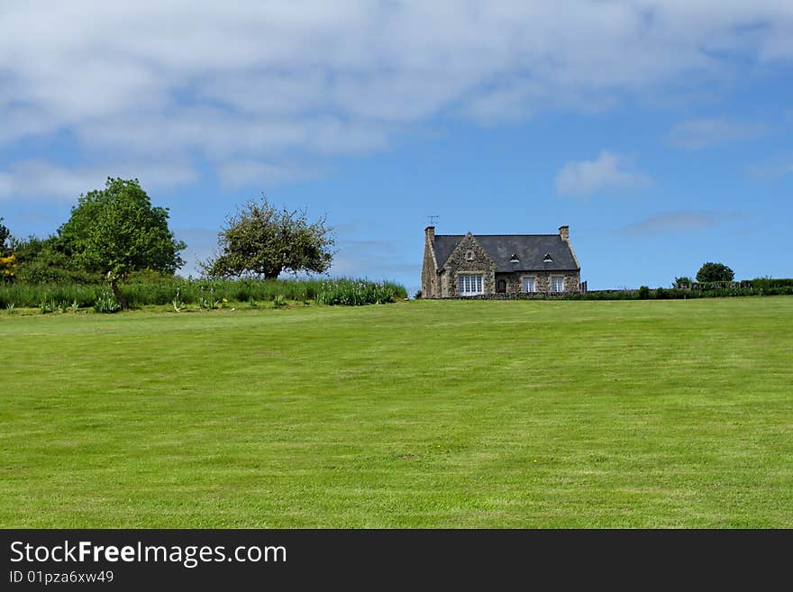 Old Brittany house on meadow