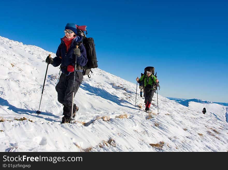 Hiker are in winter in mountains