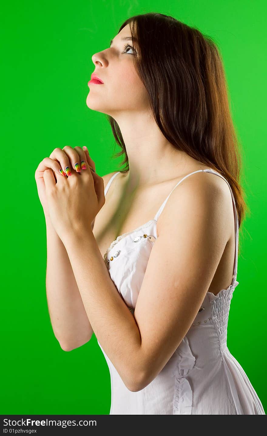 Beautiful young woman with long hair in a white summer dress. Beautiful young woman with long hair in a white summer dress