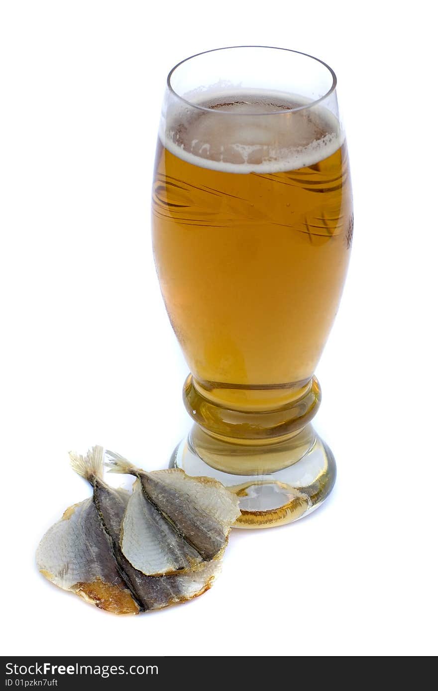 Food and drinks: Beer in a glass and salty fish on a white background. Food and drinks: Beer in a glass and salty fish on a white background