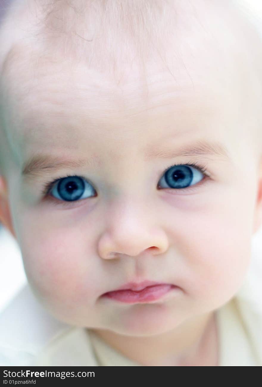 Portrait of a beautiful child of a serious on white background. Portrait of a beautiful child of a serious on white background