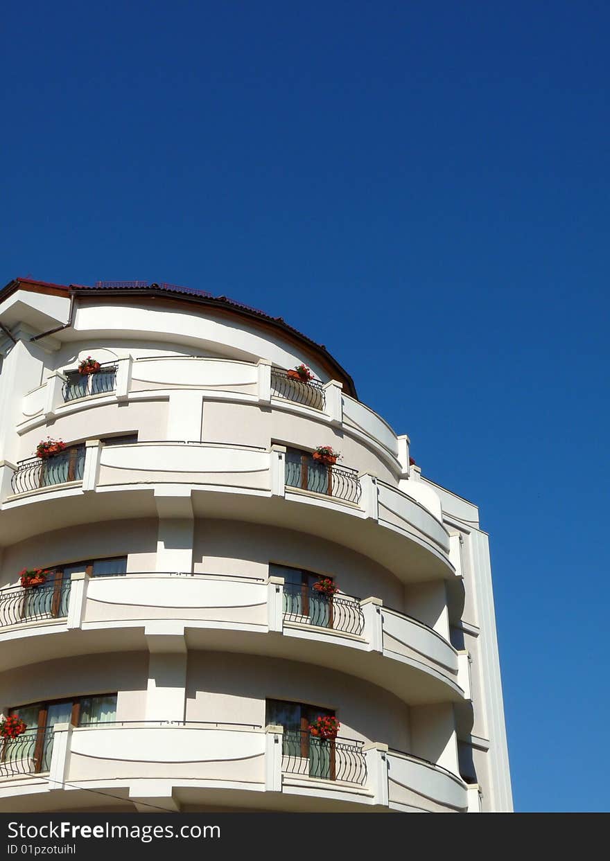 White building blue sky background