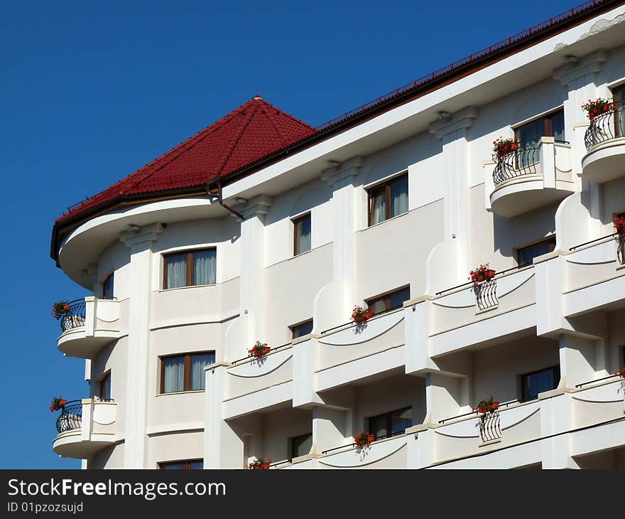 White Building Blue Sky Background