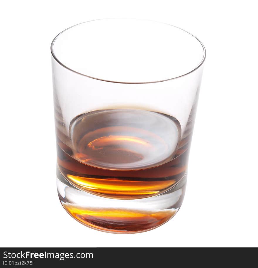 Color photo of a glass of whiskey on a white background