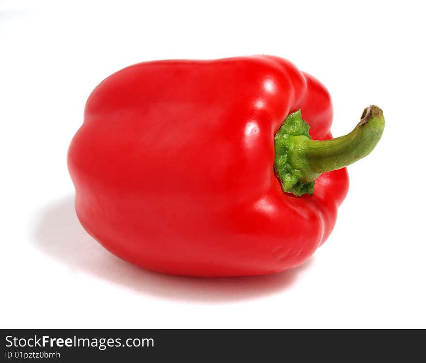 Color photograph of red peppers on a white background