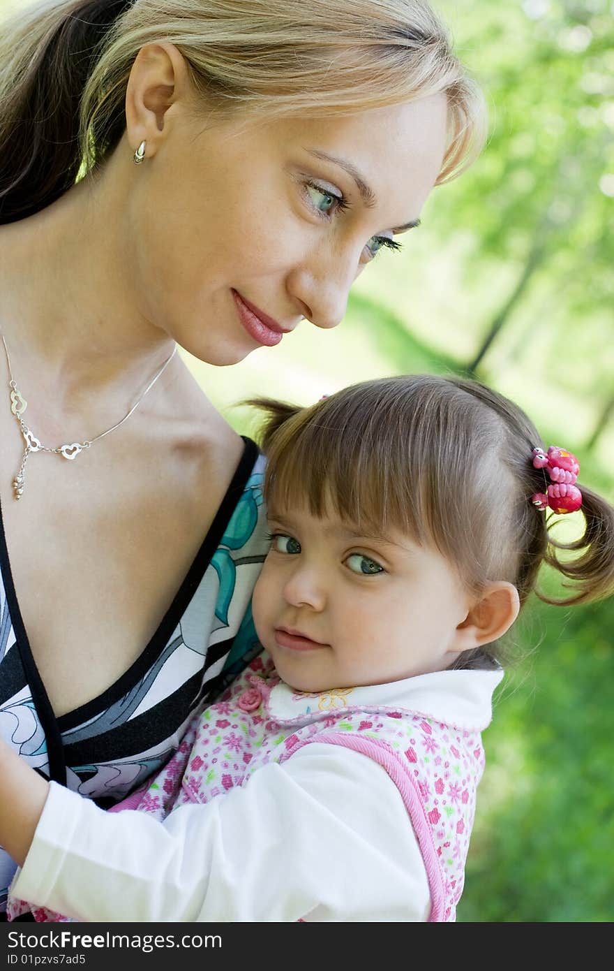 Mother and daughter outdoor in Summer park