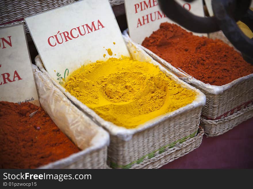 Different spices in wicker baskets