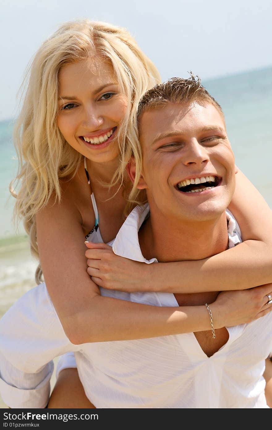 Couple lazing beside the beach