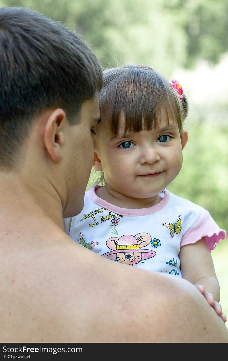 Father and daughter outdoor in summer tender shot