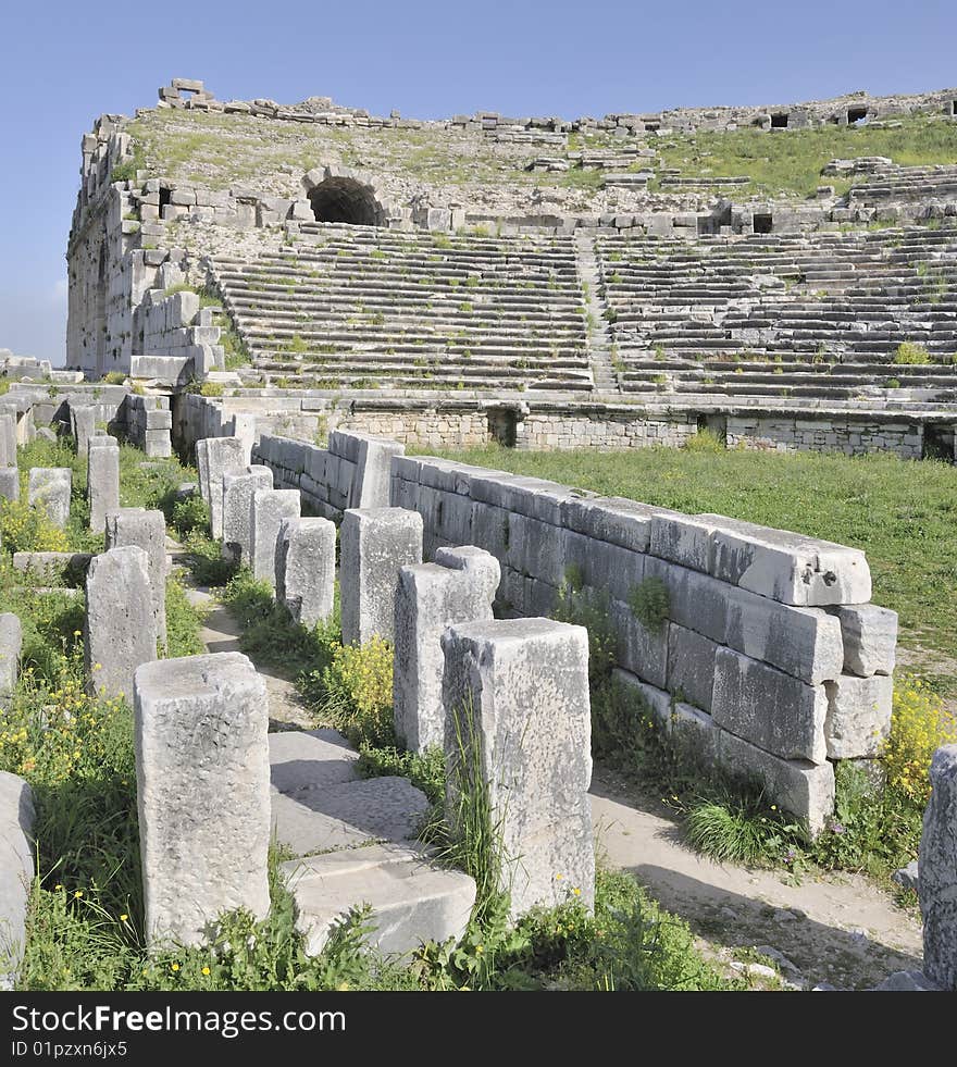 The ancient amphitheater at Miletus, Turkey, showing the columns that once supported the stage, with the amphitheater seating behind