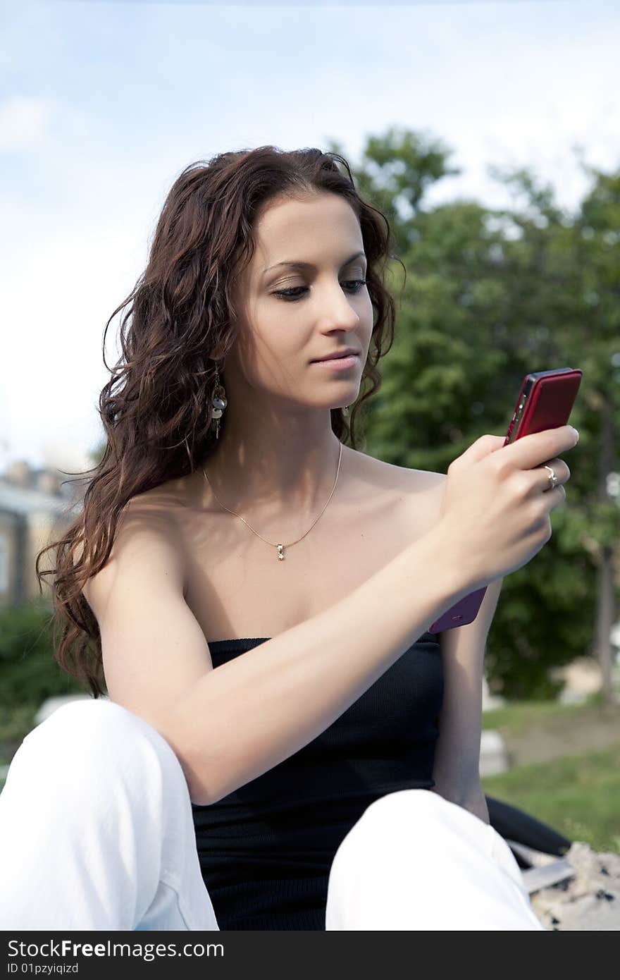 Woman with mobile phone outdoor