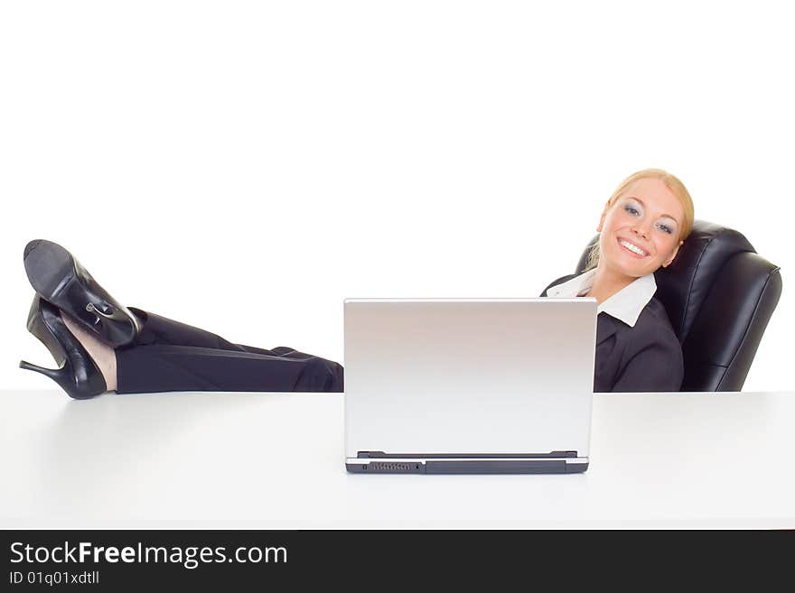 Businesswoman relaxing with lags on table